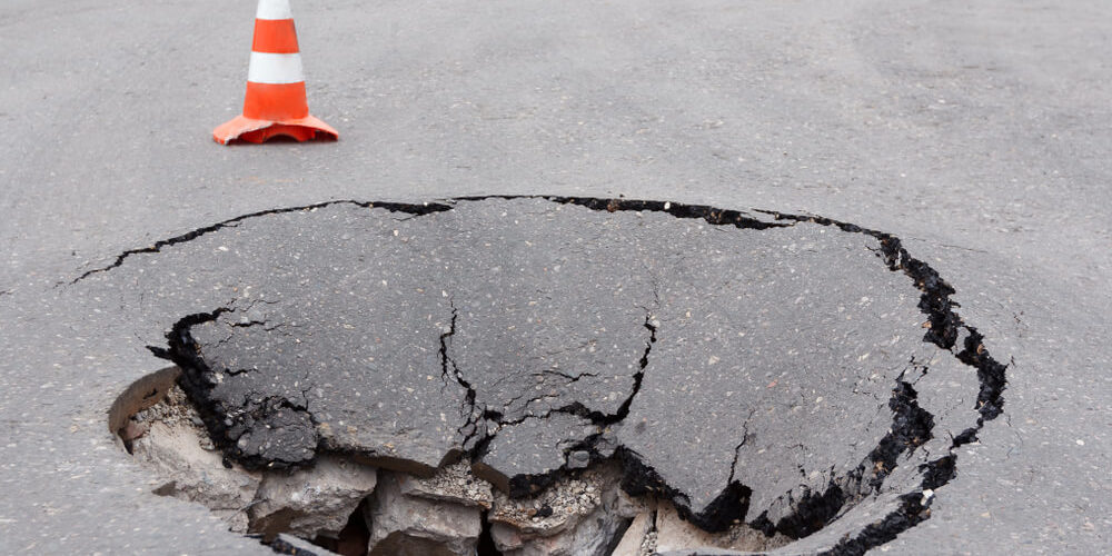 Asphalt-Sinkholes-Bulldog-Adjusters-1000x500